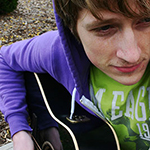 a boy playing guitar